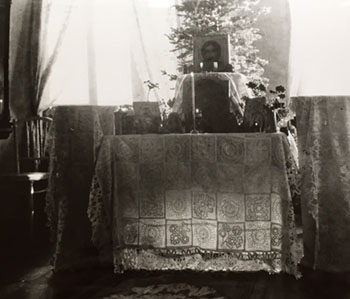Empress Alexandra's white lace bedspread serving as an altar cloth.