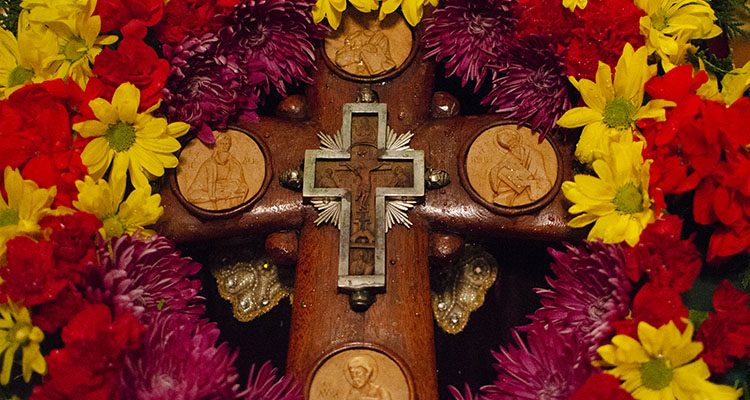 Cross surrounded by flowers