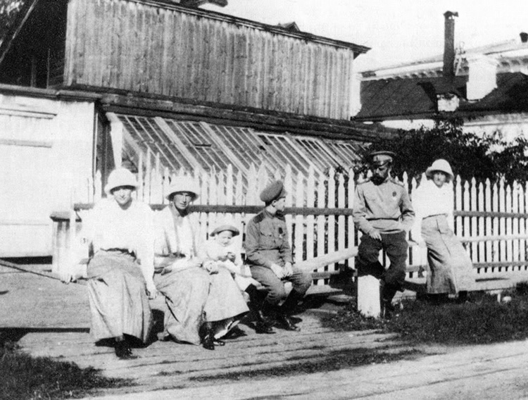 Nicholas II in Tobolsk sitting outside with his children